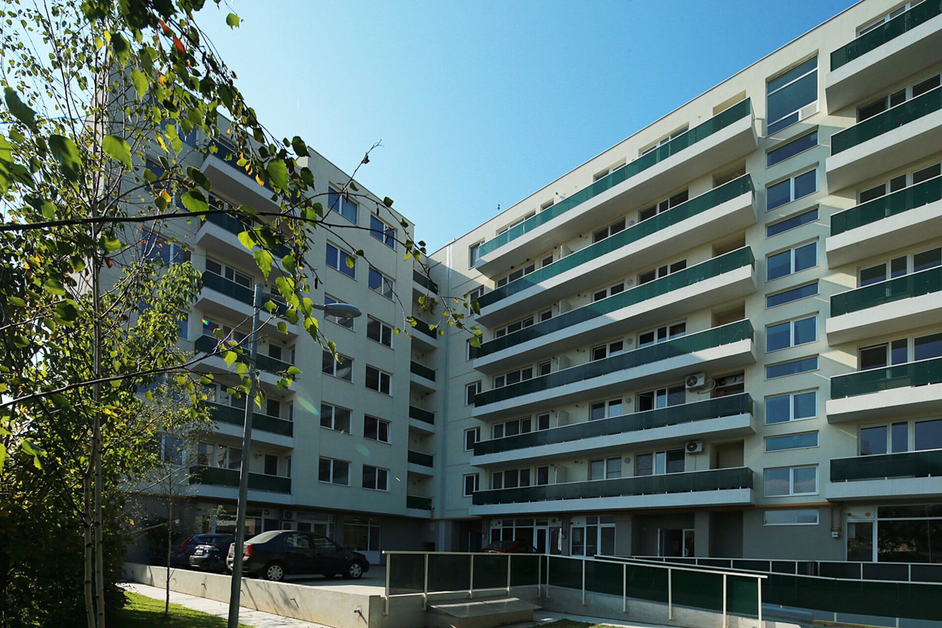 The facade of the B+G+6F residential building in Buftea, with retail spaces on the ground floor, a PPAE project